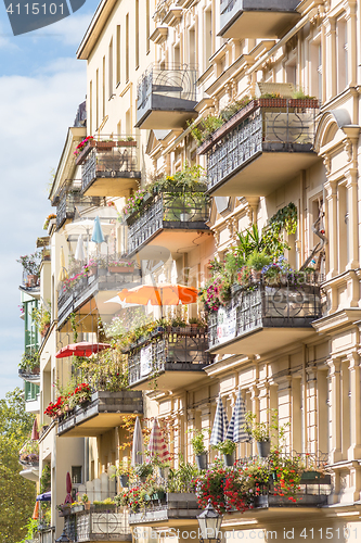 Image of Traditional European Balcony with colorful flowers and flowerpots.