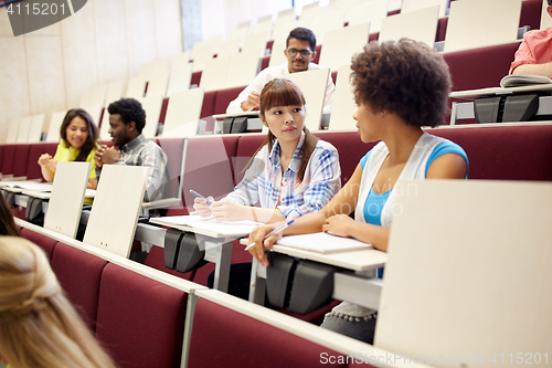 Image of group of international students talking on lecture