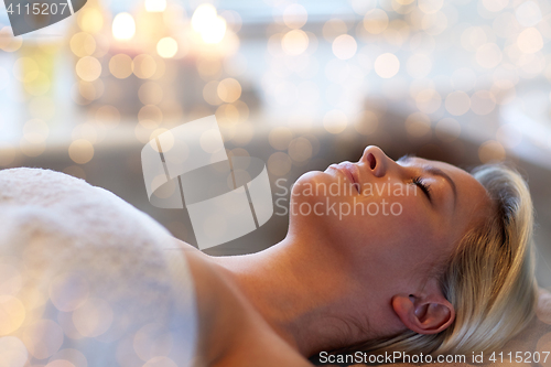 Image of young woman lying in spa