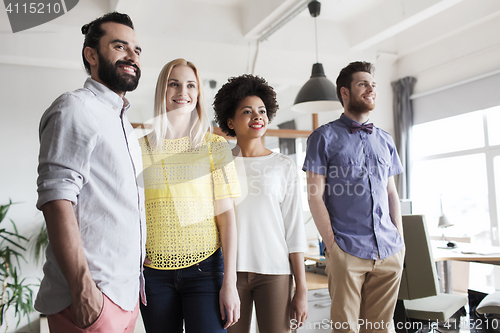 Image of happy creative team in office