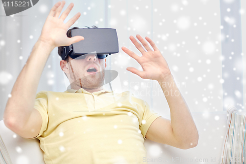 Image of young man in virtual reality headset or 3d glasses