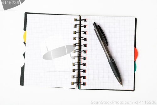 Image of notepad with pen isolated