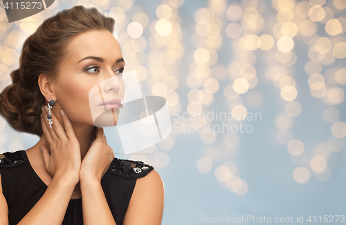 Image of smiling woman in evening dress and earring