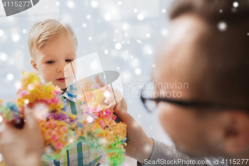 Image of father and son playing with ball clay at home