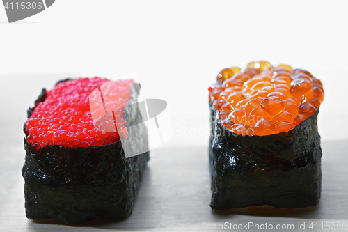 Image of Tobiko and Ikura sushi closeup