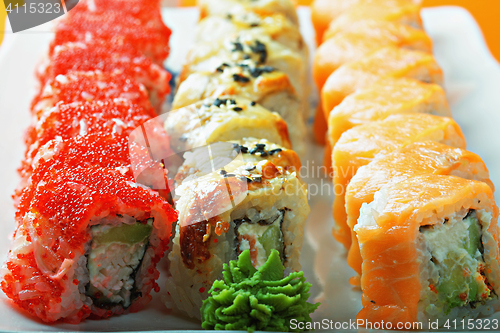 Image of Different sushi rolls and wasabi closeup