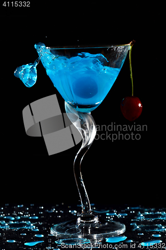 Image of Splashing cocktail with cherry