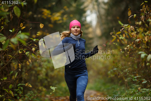 Image of Blonde woman running in morning