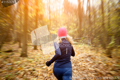 Image of Girl in pink hat jogging