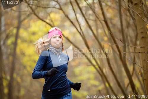 Image of Young female running in morning