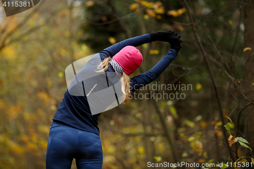 Image of Young blonde woman at gym