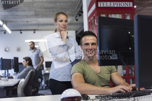 Image of business couple at office