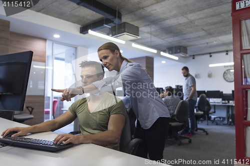 Image of business couple at office