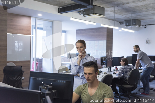 Image of business couple at office