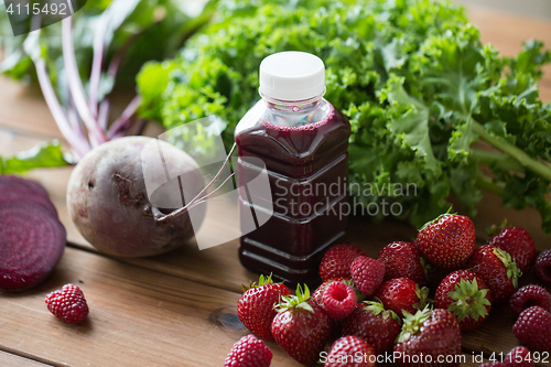 Image of bottle with beetroot juice, fruits and vegetables