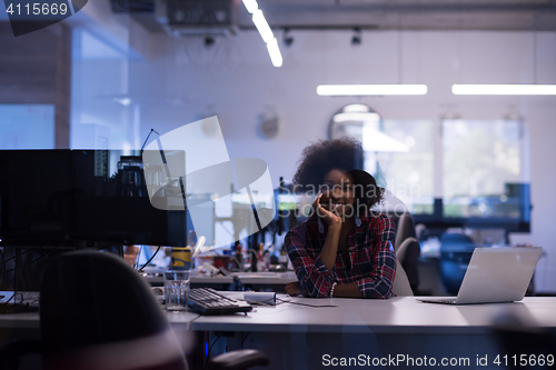 Image of young black woman at her workplace in modern office  African-Ame