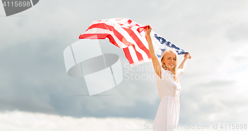 Image of happy woman with american flag outdoors