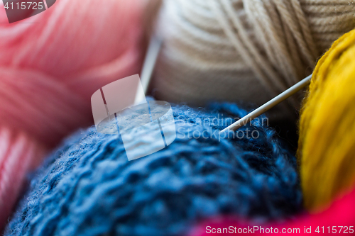 Image of close up of knitting needles and yarn balls