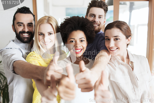 Image of happy creative team in office