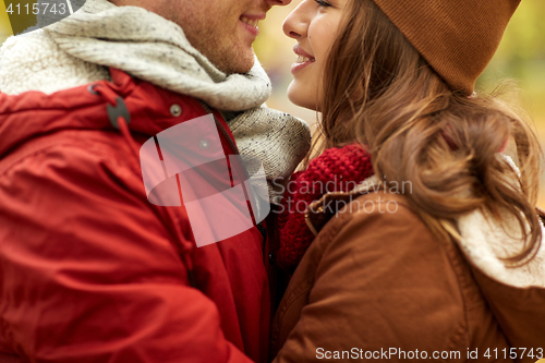 Image of close up of happy young couple kissing outdoors