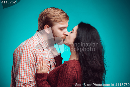 Image of Young man and woman kissing