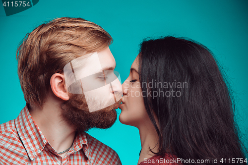 Image of Young man and woman kissing