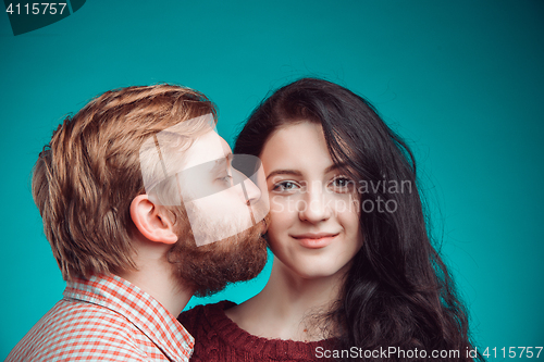 Image of Young man and woman kissing