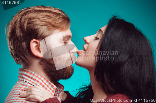 Image of Young man and woman kissing