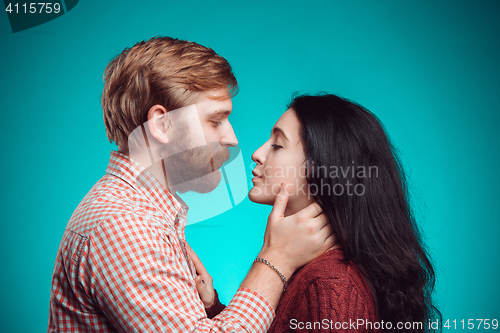 Image of Young man and woman kissing