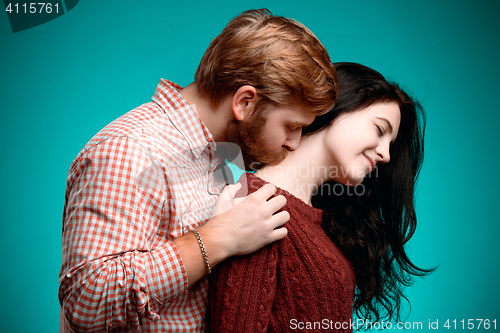 Image of Young man and woman kissing