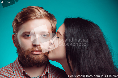 Image of Young man and woman kissing