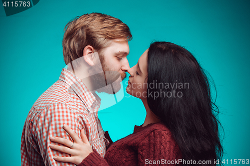 Image of Young man and woman kissing