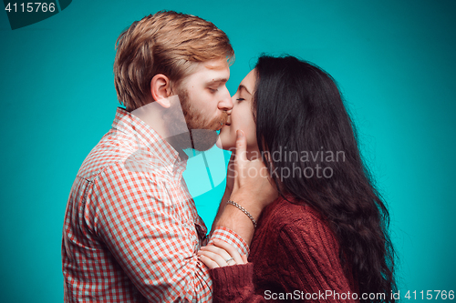 Image of Young man and woman kissing