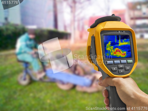 Image of Recording with Thermal camera workers cutting grass in city park