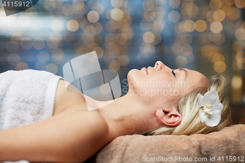 Image of young woman lying in spa