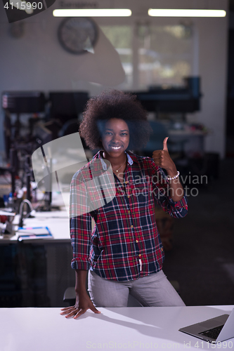 Image of young black woman at her workplace in modern office  African-Ame