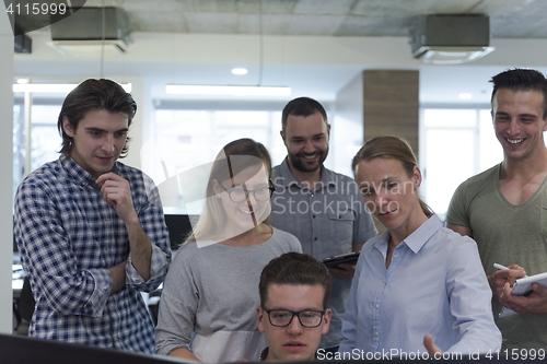 Image of startup business people group working as team to find solution