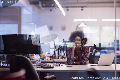Image of young black woman at her workplace in modern office  African-Ame