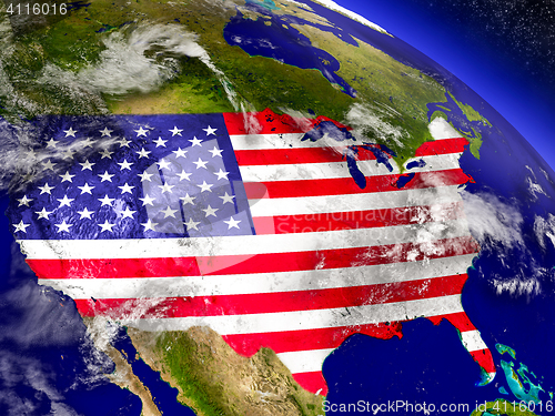 Image of USA with embedded flag on Earth