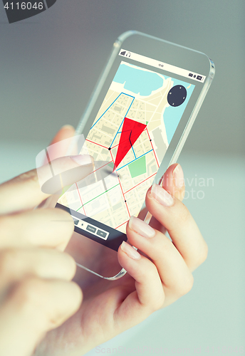 Image of close up of woman with gps navigator on smartphone