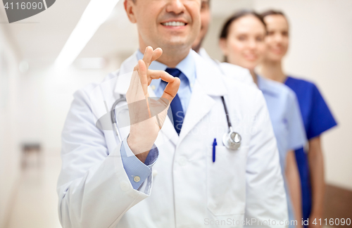 Image of close up of doctors at hospital showing ok sign
