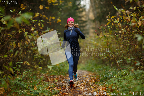 Image of Portrait in full growth of running young women in forest