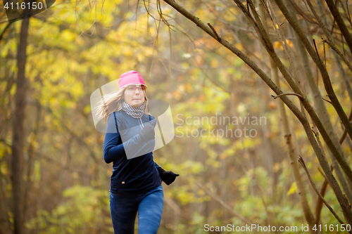 Image of Beautiful woman running in morning