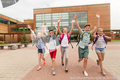 Image of group of happy elementary school students running