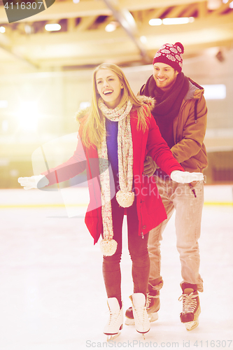 Image of happy couple on skating rink