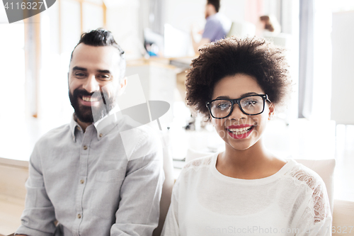 Image of happy creative team in office