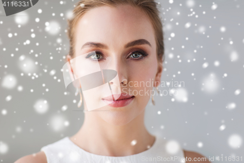 Image of close up of beautiful woman or bride over snow