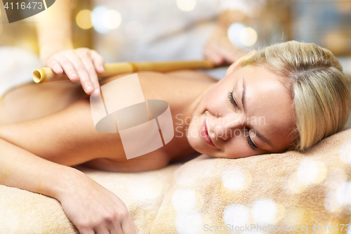 Image of close up of woman lying and having massage in spa