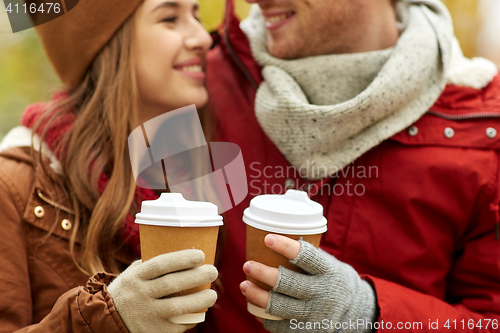 Image of close up of happy couple with coffee in autumn