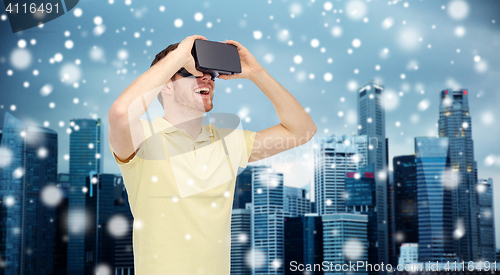 Image of happy man in virtual reality headset or 3d glasses